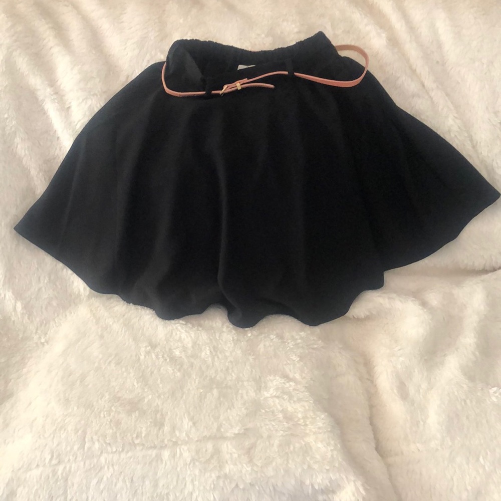 Black skirt with skinny pink belt.